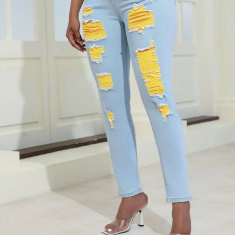 Stylish Light Blue Distressed Jeans with Yellow Accents